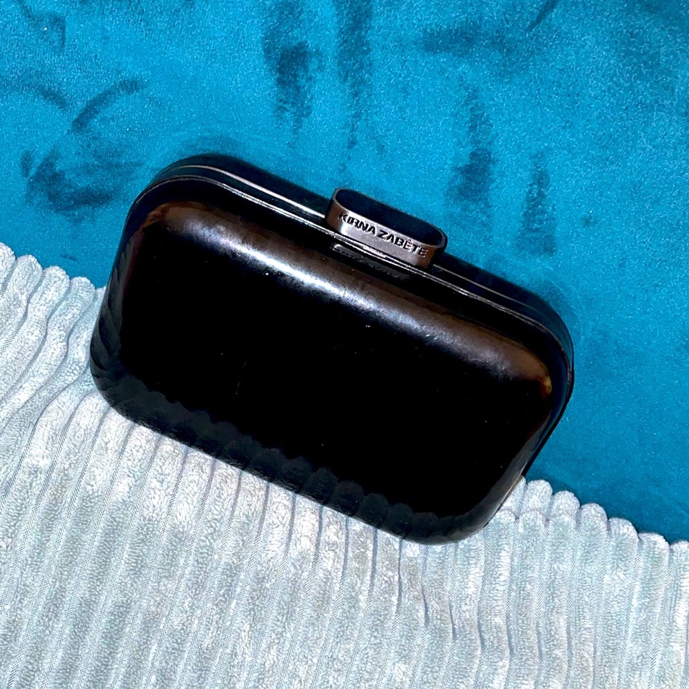 Every lady needs a Little black Clutch/ purse